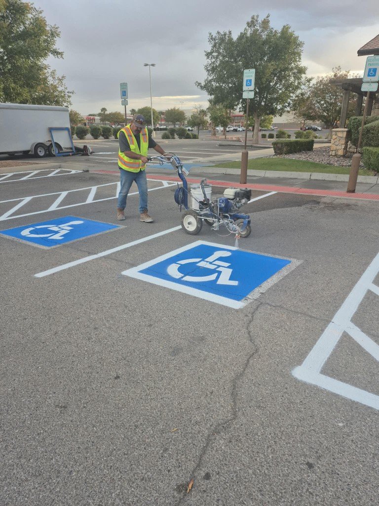 Line striper painting handicap parking symbol