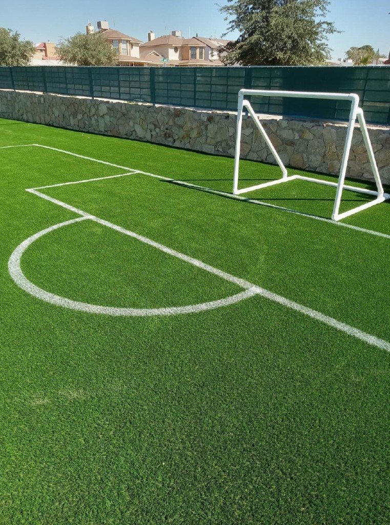 Community sports field with precision line striping on turf